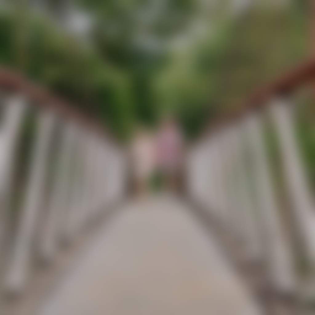 Couple walking on Buchan Swing Bridge over Buchan river