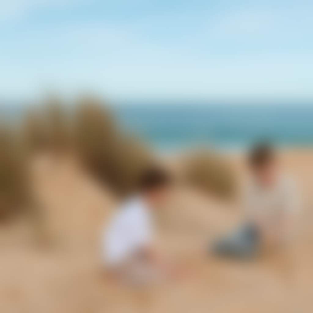 Loch Sport Beach children sitting in sand with ocean view