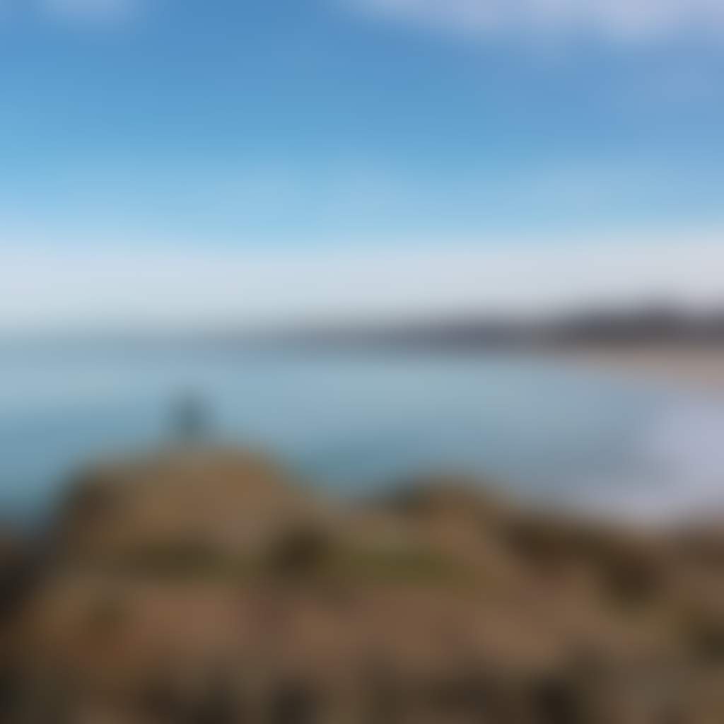 Cape Conran lady standing on rocks over beach