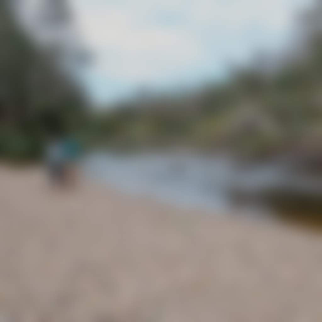 Ramrod creek Bruthen Tambo River couple stands on rocky shore
