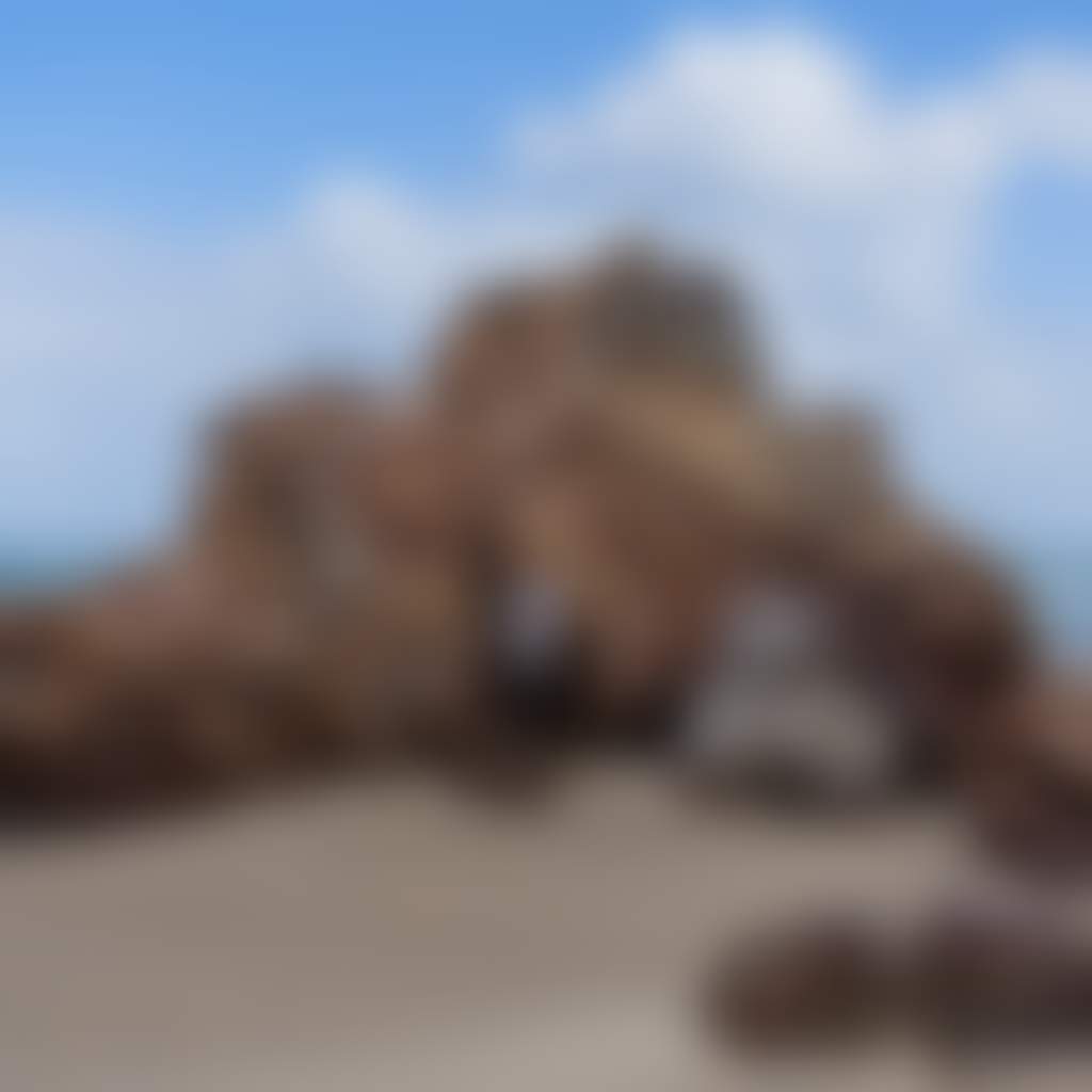 Betka Beach Mallacoota man standing in front of rock on sand