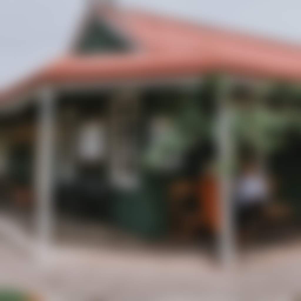 Briagolong Hotel girls sitting outside green pub verandah under grape vine