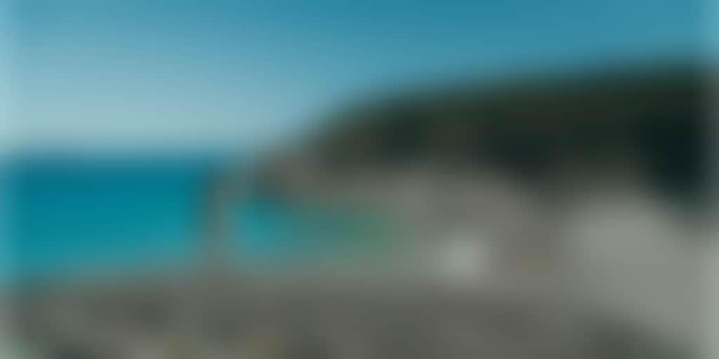 Squeaky Beach Wilsons Prom woman standing on rocks in front of turquoise water