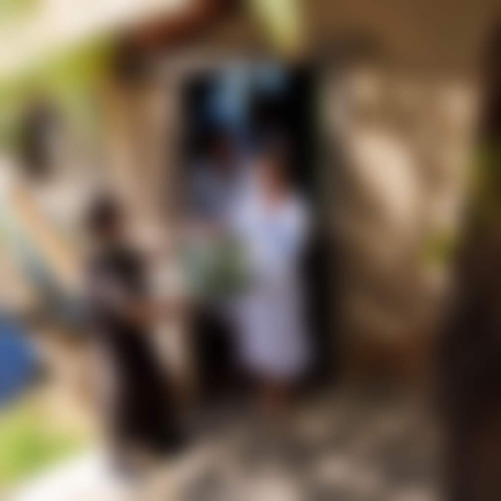 Couple receiving package at accommodation Metung Hot Springs