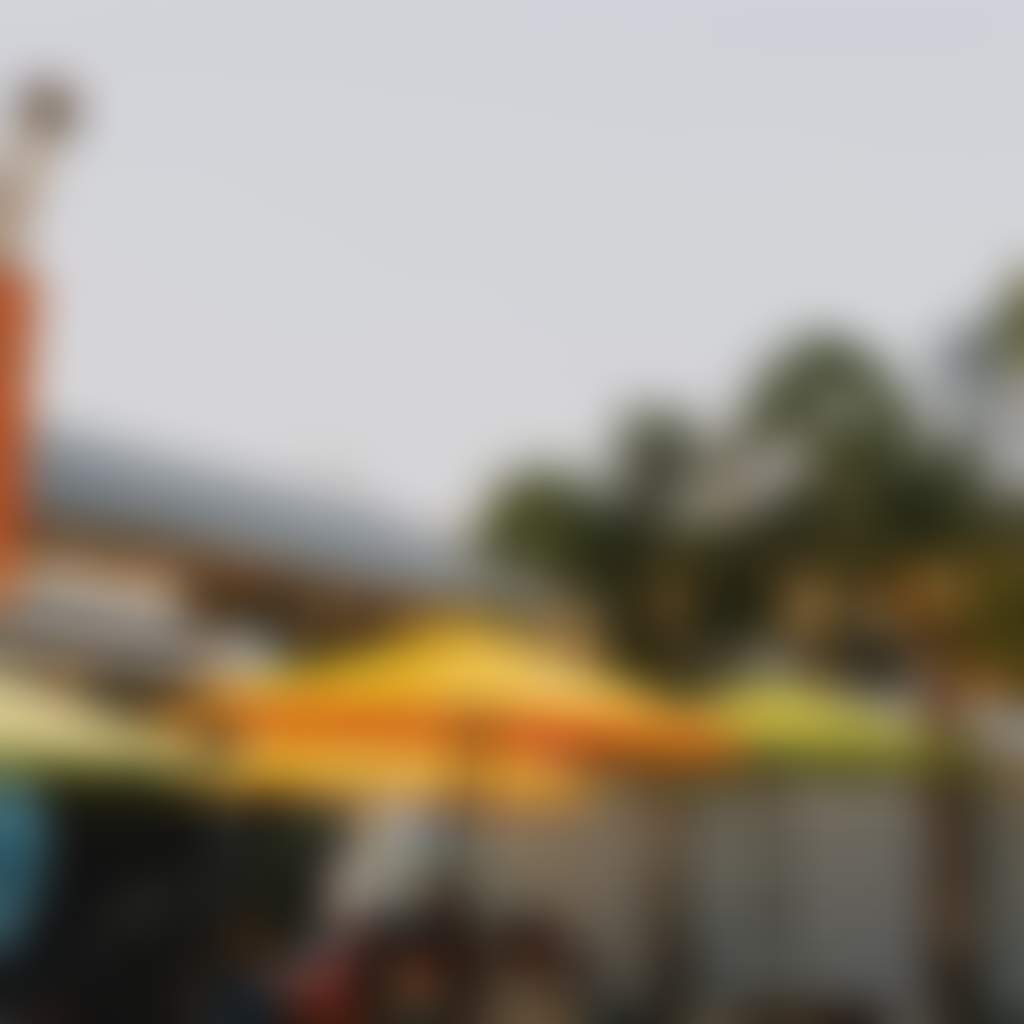 Five Aces Brewing Neerim South view of beer garden with artwork palm trees and crooked chimney