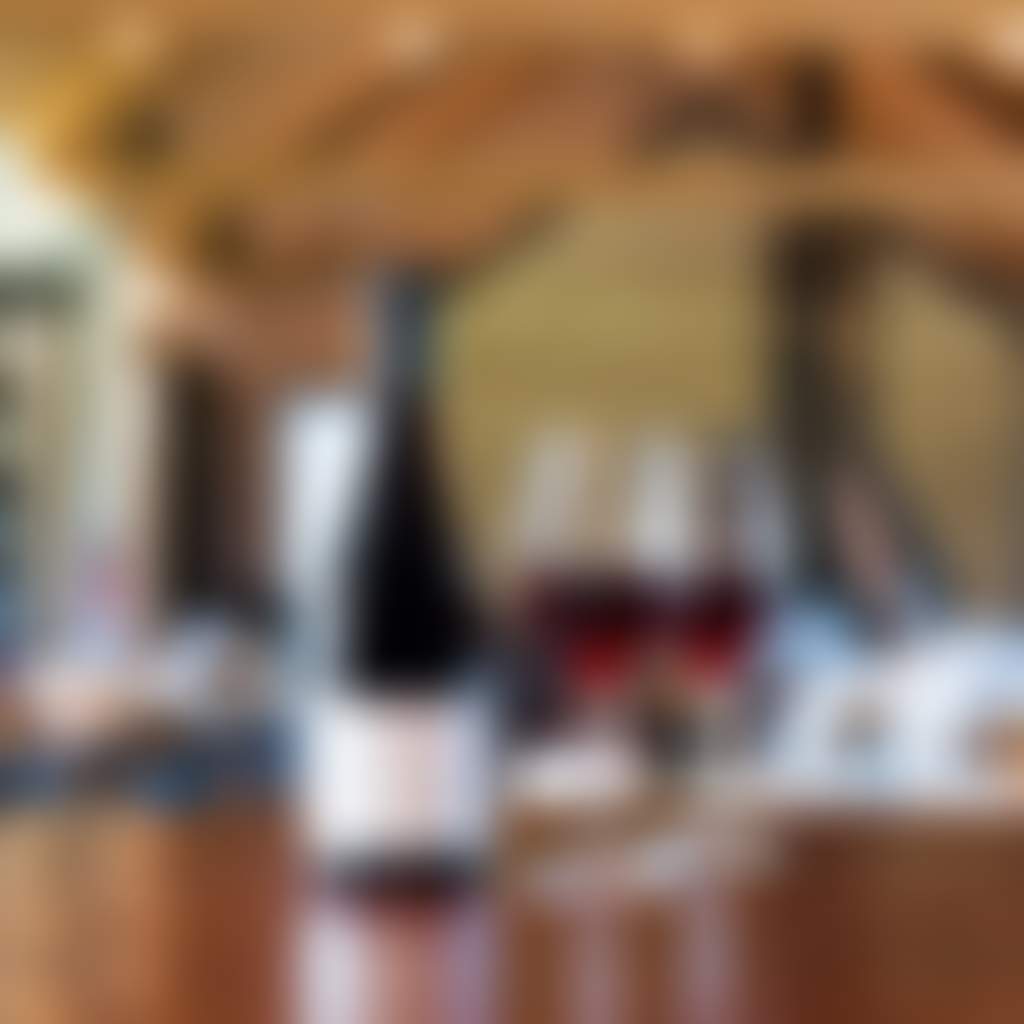 Cannibal Creek Winery wines on bench in dining room