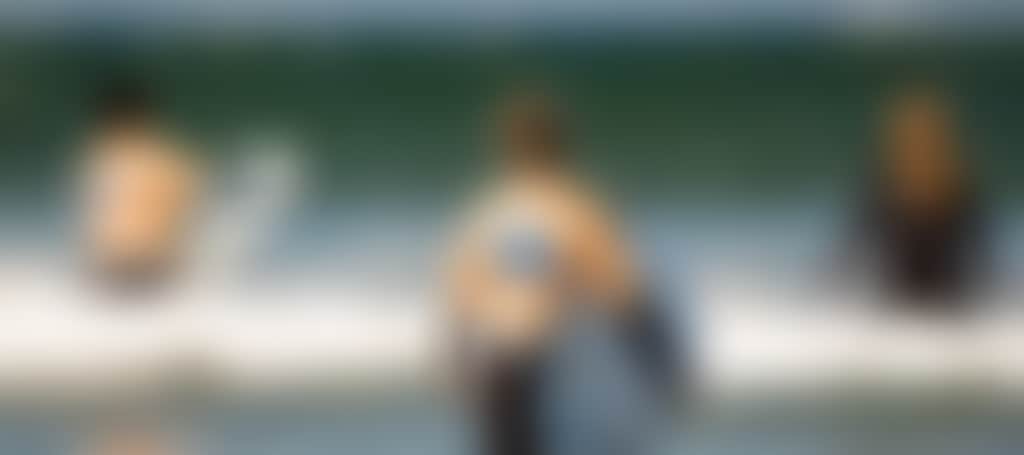 Three surfers near Inverloch South Gippsland