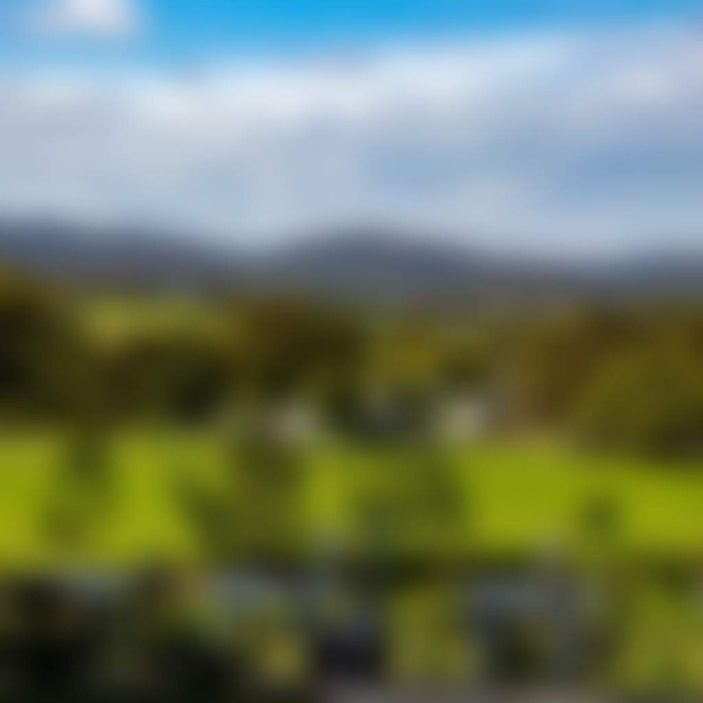Glenmaggie Wines Tinamba view of outside tables and green hills