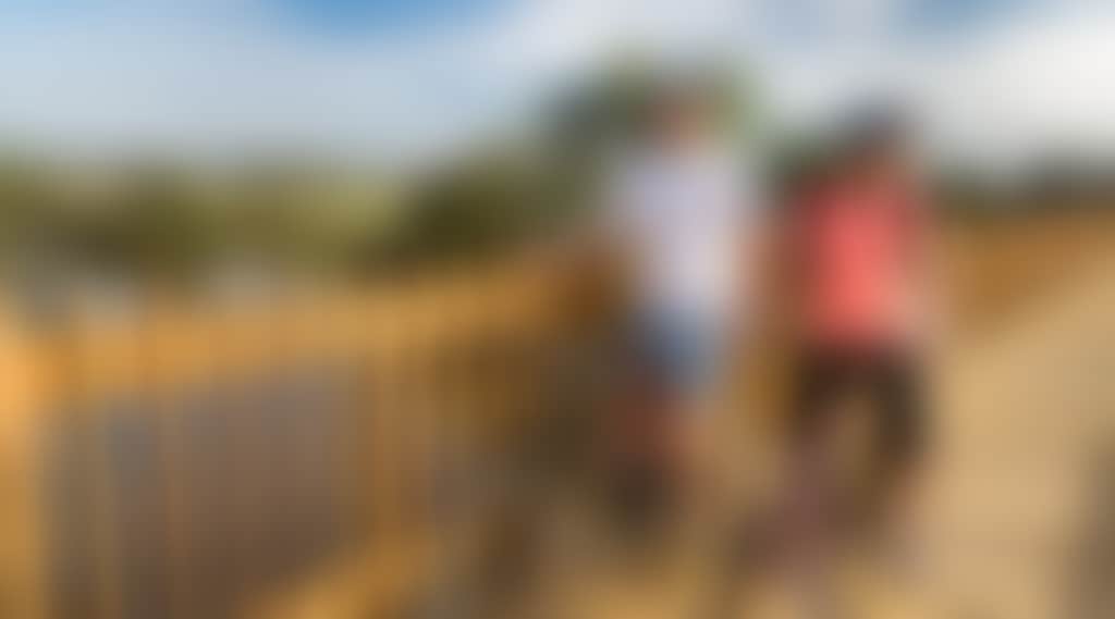 Gippsland Plains Rail Trail Couple Cycling on Bridge