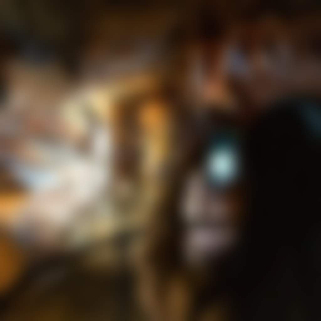 Girl taking photo on phone in Buchan Caves
