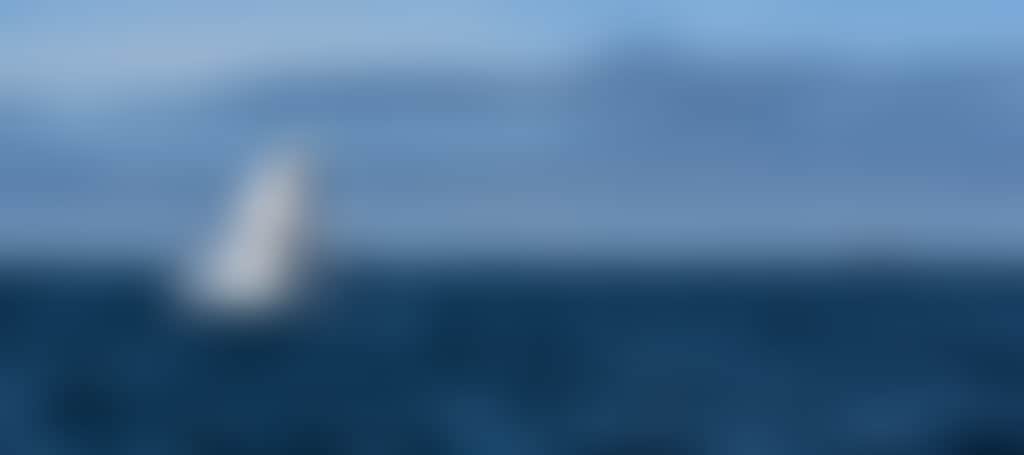 Whale breaching in front of islands at Wilsons Promontory South Gippsland
