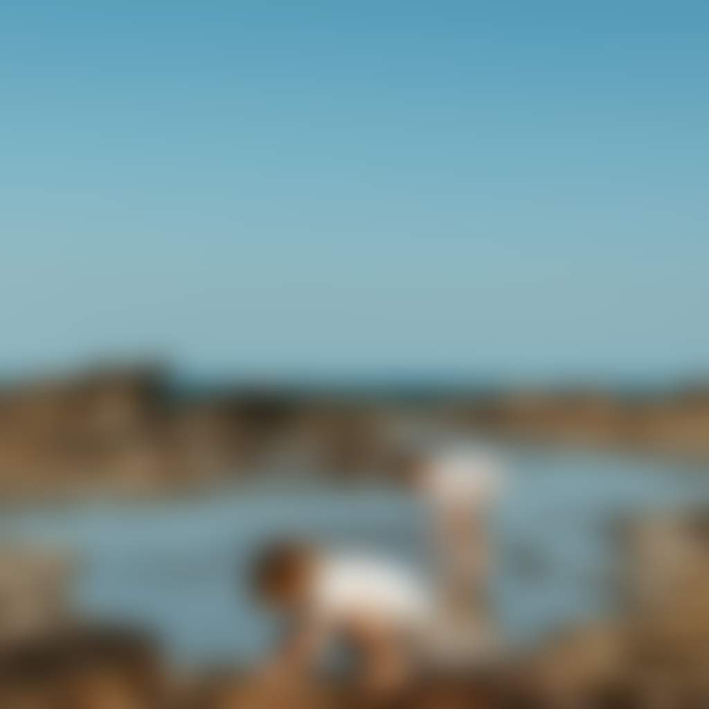 Two children looking into rock pools Eagles Nest Bunurong Marine Park