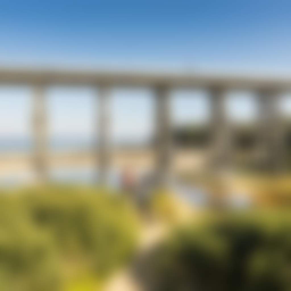 Kilcunda Trestle Bridge three people walking along trail in front of bridge