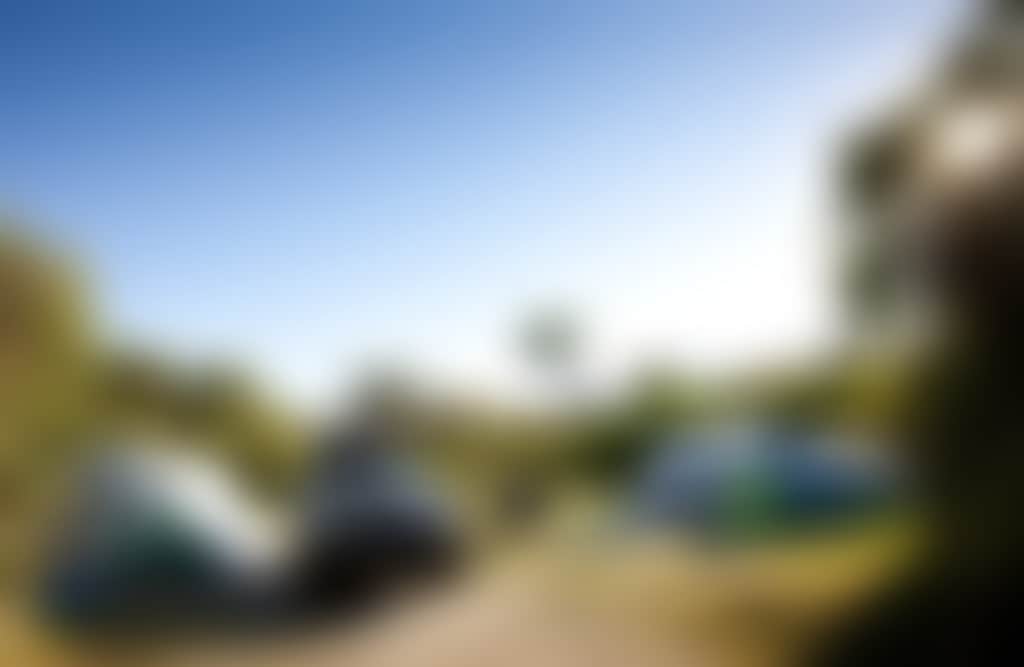 Tidal River Wilsons Prom camping ground with tents and 4 WD car surrounded by bush