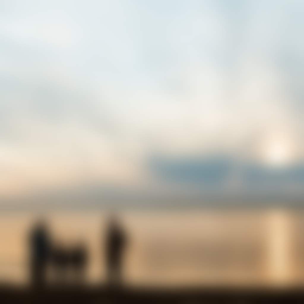 Loch Sport Beach family watching sunset over water