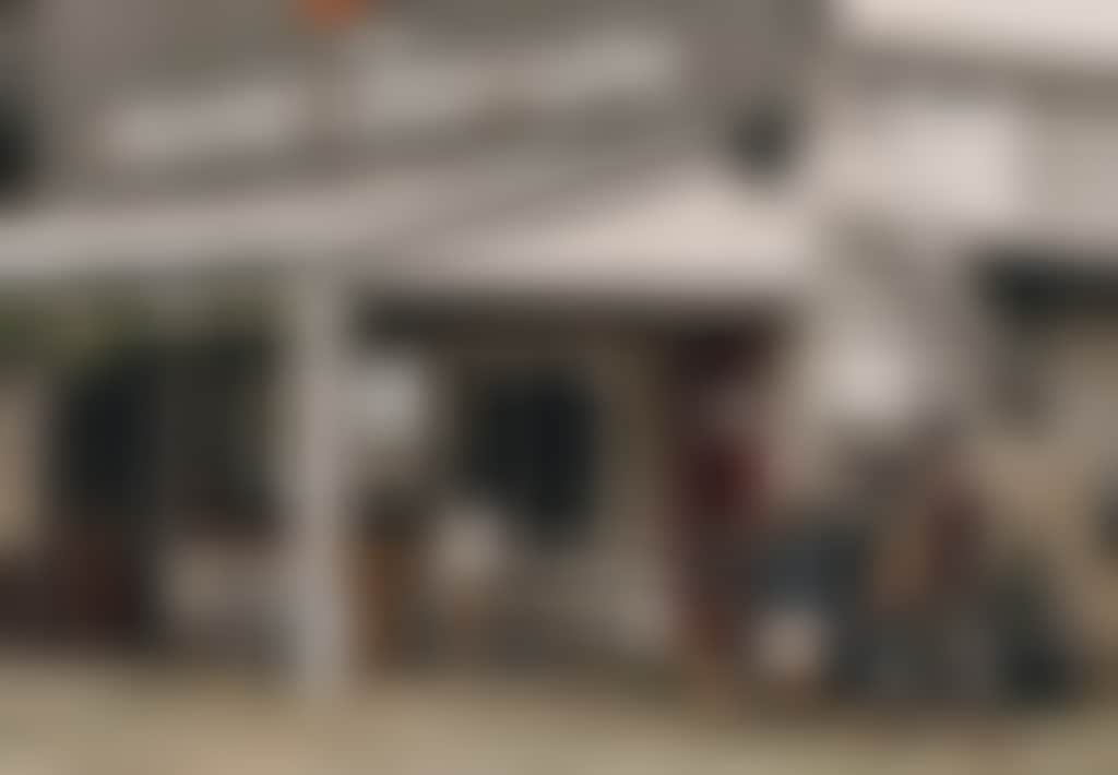 Hicksborough Store and Cafe family walking past verandah