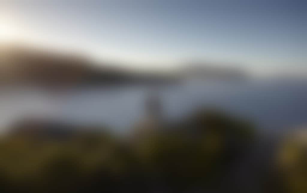 Couple Overlooking Water from Rocks at Pillar Point in Wilsons Prom