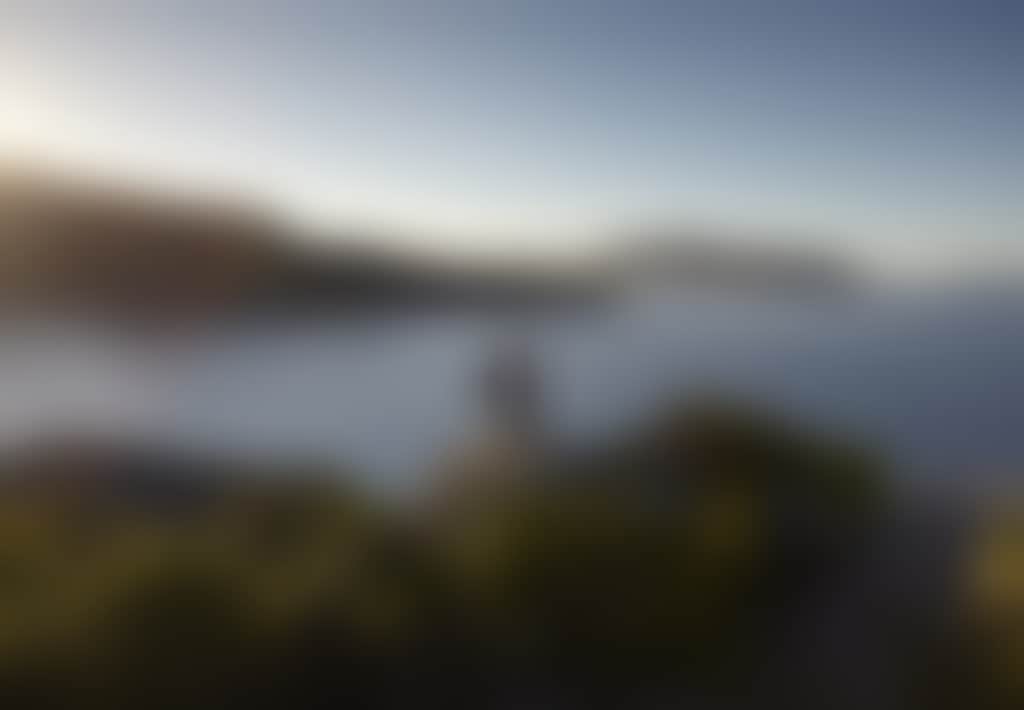 Couple Overlooking Water from Rocks at Pillar Point in Wilsons Prom
