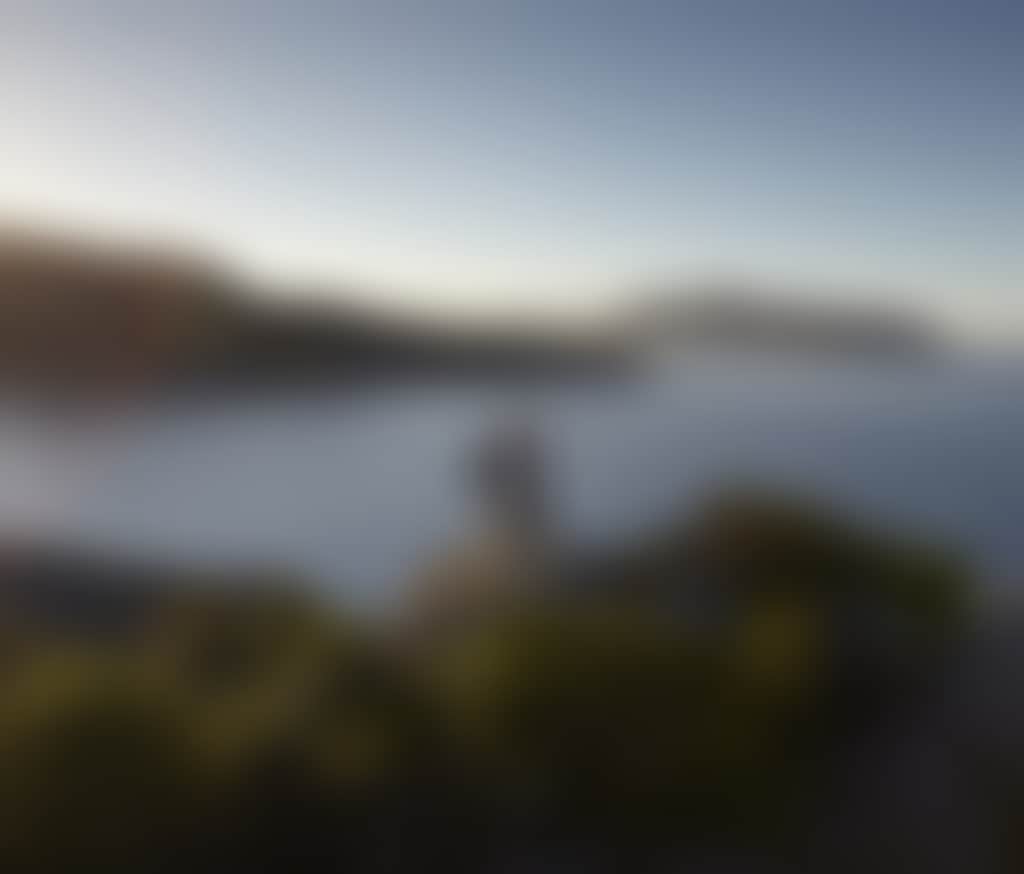 Couple Overlooking Water from Rocks at Pillar Point in Wilsons Prom