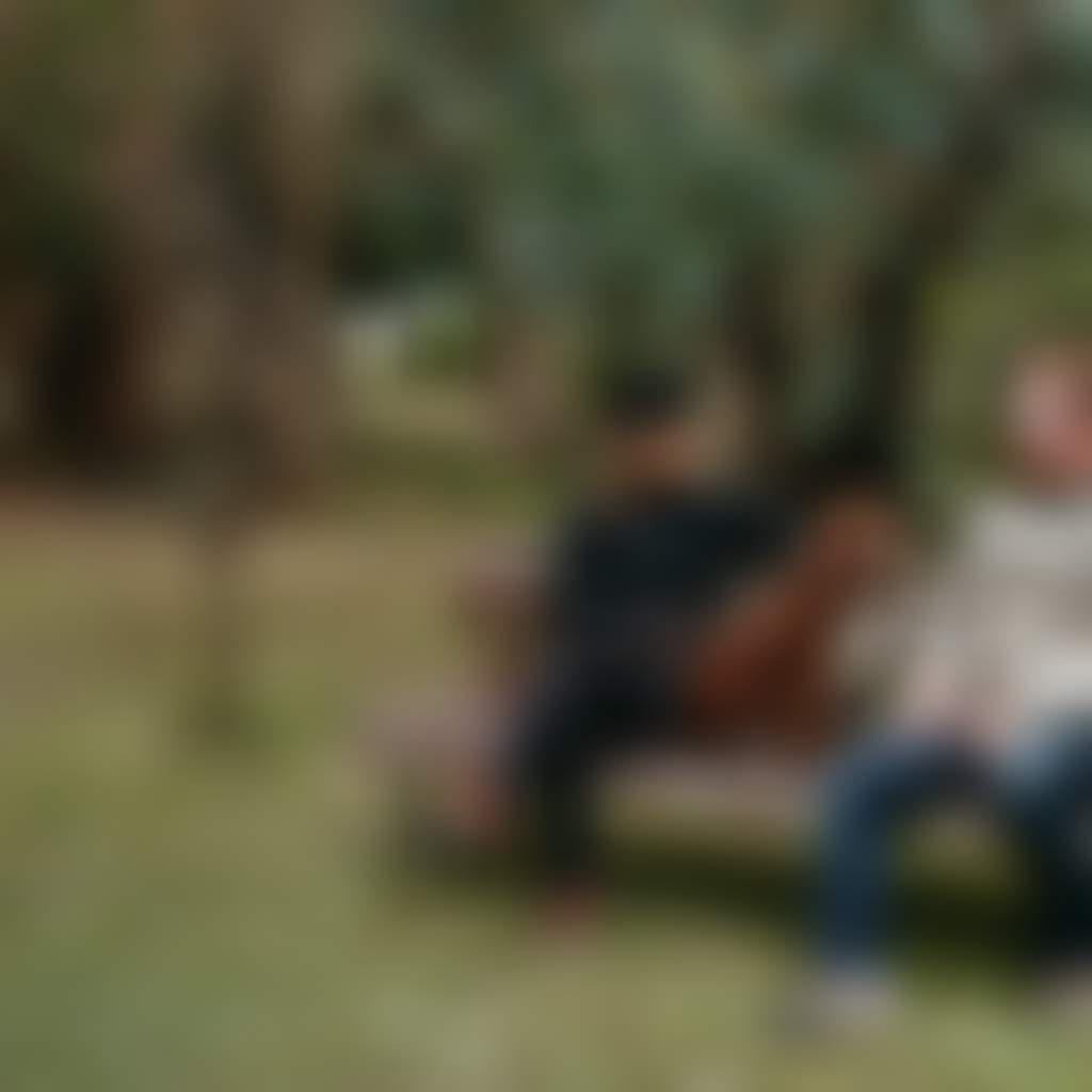Laurie Collins Sculpture Garden couple sitting with dog on park bench