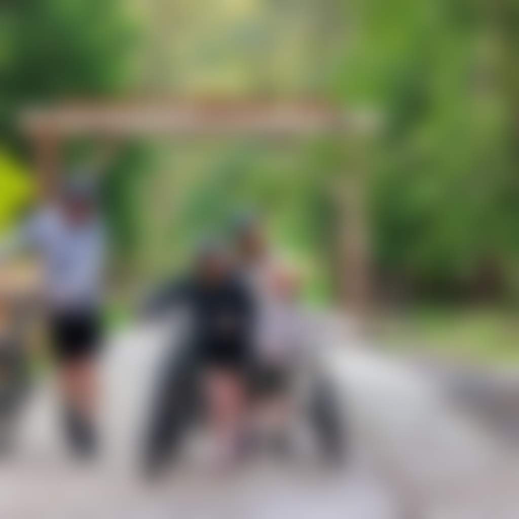Rokeby Neerim Rail Trail family on bikes walking under trailhead sign