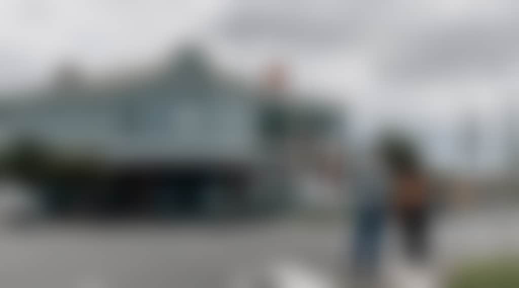 Heesco Town Couple looking at Yarram Murals Federal Coffee Palace building