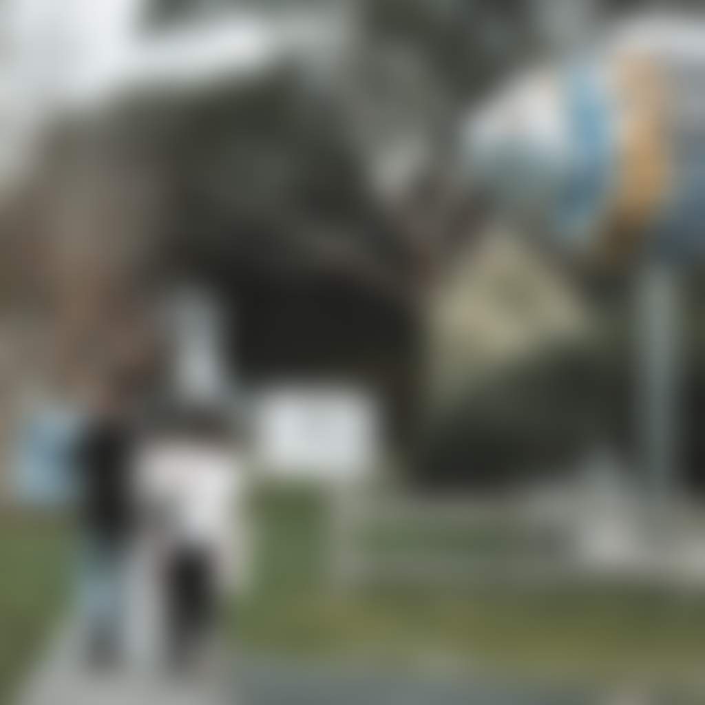 Fish Creek family walking through town near fish sculpture