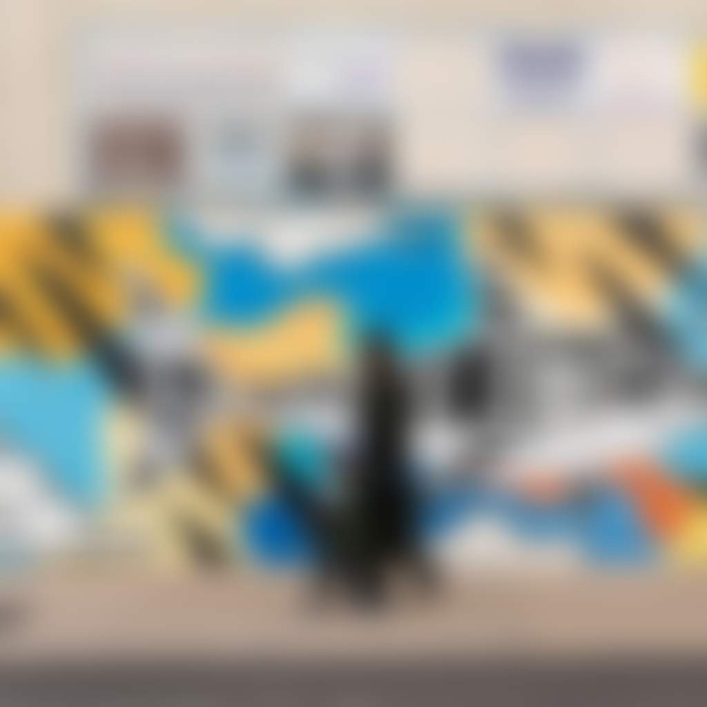 Moe streetscape people walking past shark mural