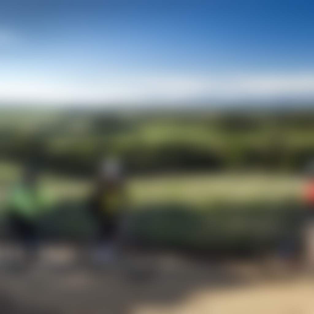 Great Southern Rail Trail group cycling past rolling green hills