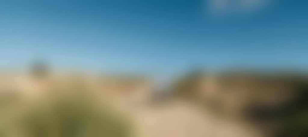 Lake Tyers Beach couple walking over sand dunes