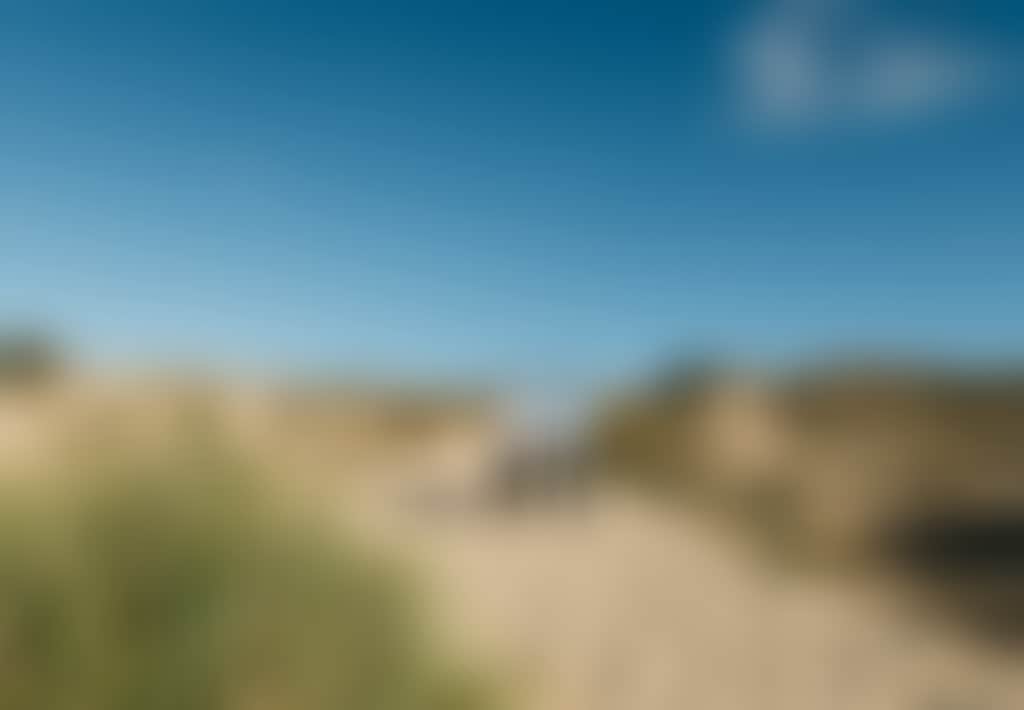 Lake Tyers Beach couple walking over sand dunes