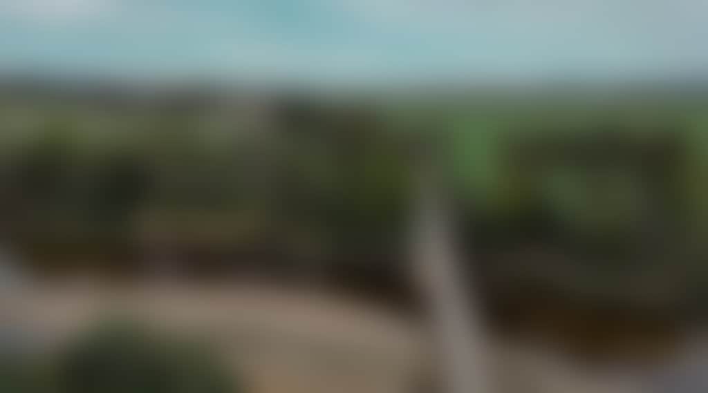 East Gippsland Rail Trail panoramic view of cyclists over bridge
