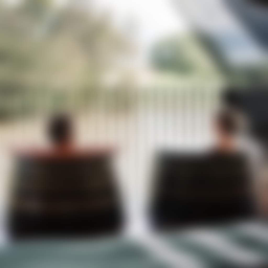 Couple in soaking barrels at Metung Hot Springs