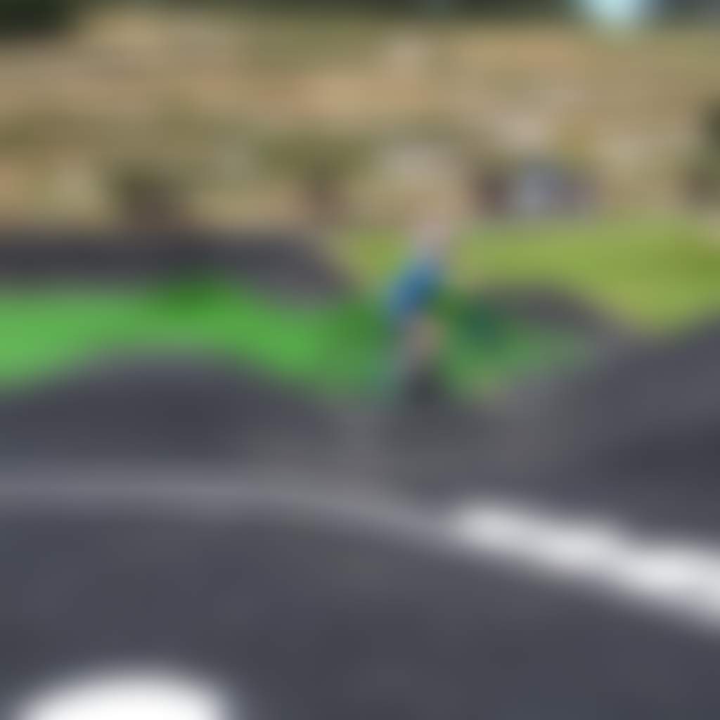 Haunted Hills Bike Park pump track with hill behind