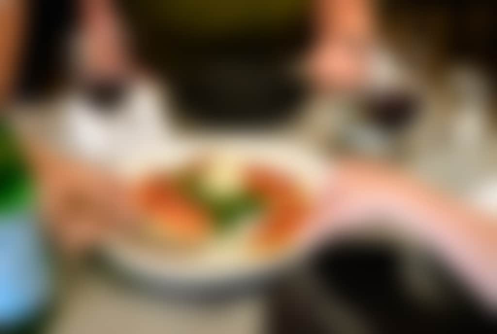 Customers eating entree at Houdinis Cafe e Cucina